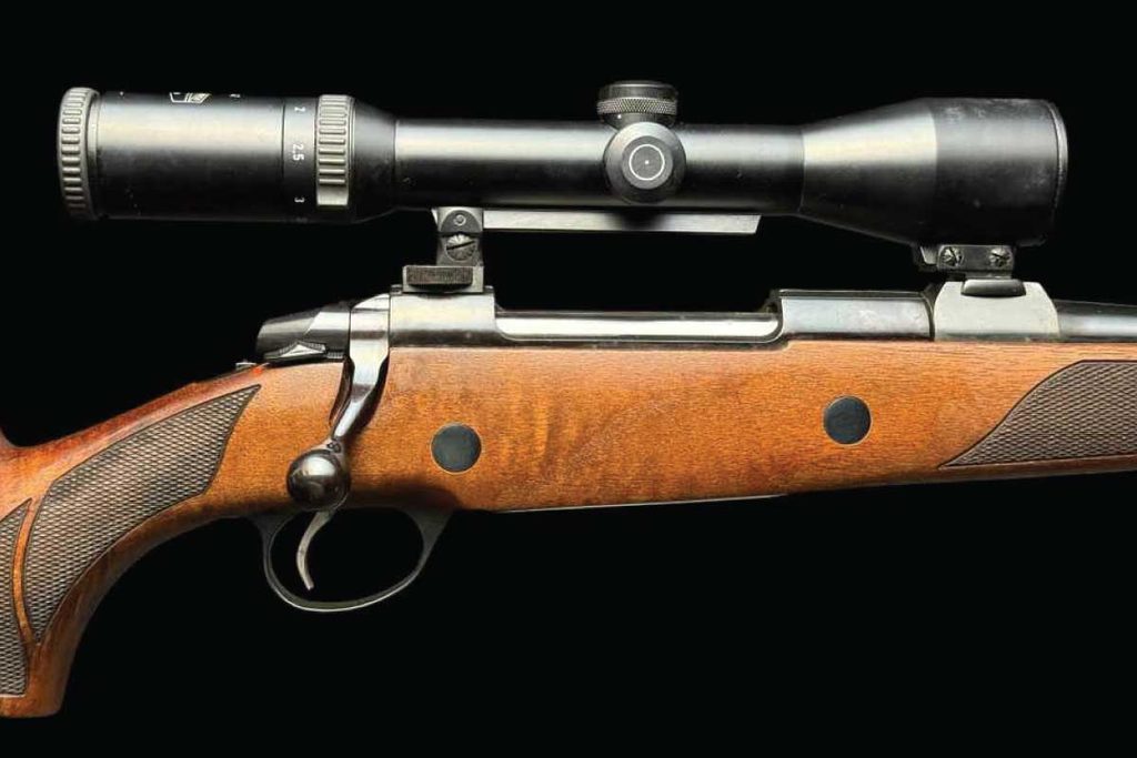 Finnish precision meets safari tradition in this beautifully appointed bolt-action rifle, featuring deluxe walnut, express sights, and a Schmidt & Bender 1.5–6x42 scope.
